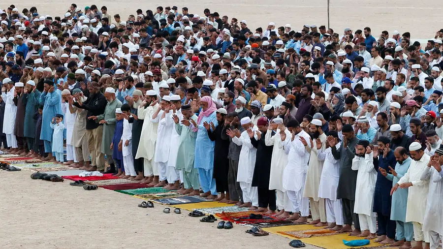 Muslims offer mass prayer during Eid ul-Adha celebrations in Karachi, Pakistan.