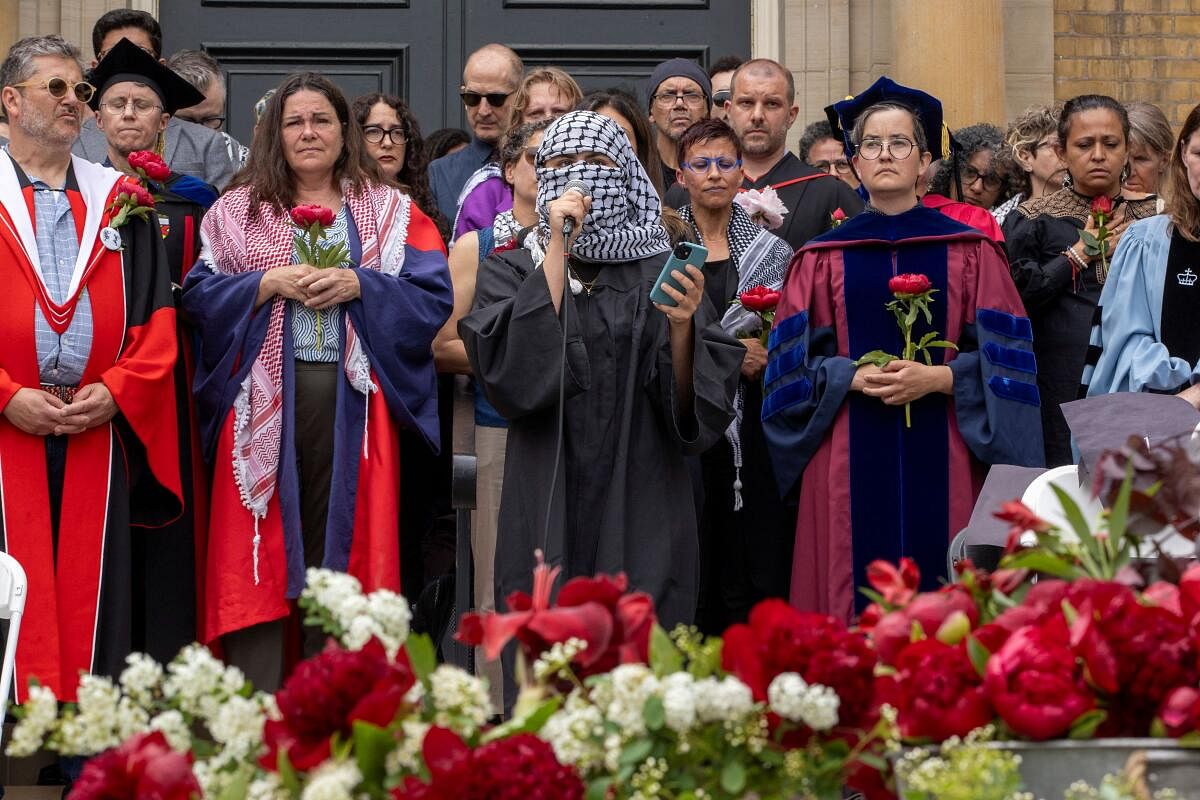 Pro-Palestinian protesters, university staff and supporters hold a graduation ceremony in honour of those in Gaza near the encampment at the University of Toronto on their first day of convocation in Toronto, Ontario, Canada, June 3, 2024.