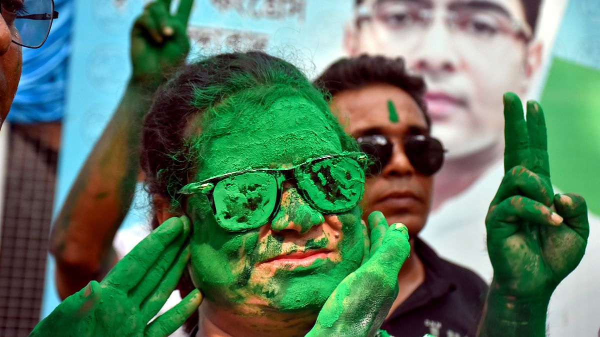 TMC supporters celebrate the party's lead during counting of votes for Lok Sabha elections, in Murshidabad.