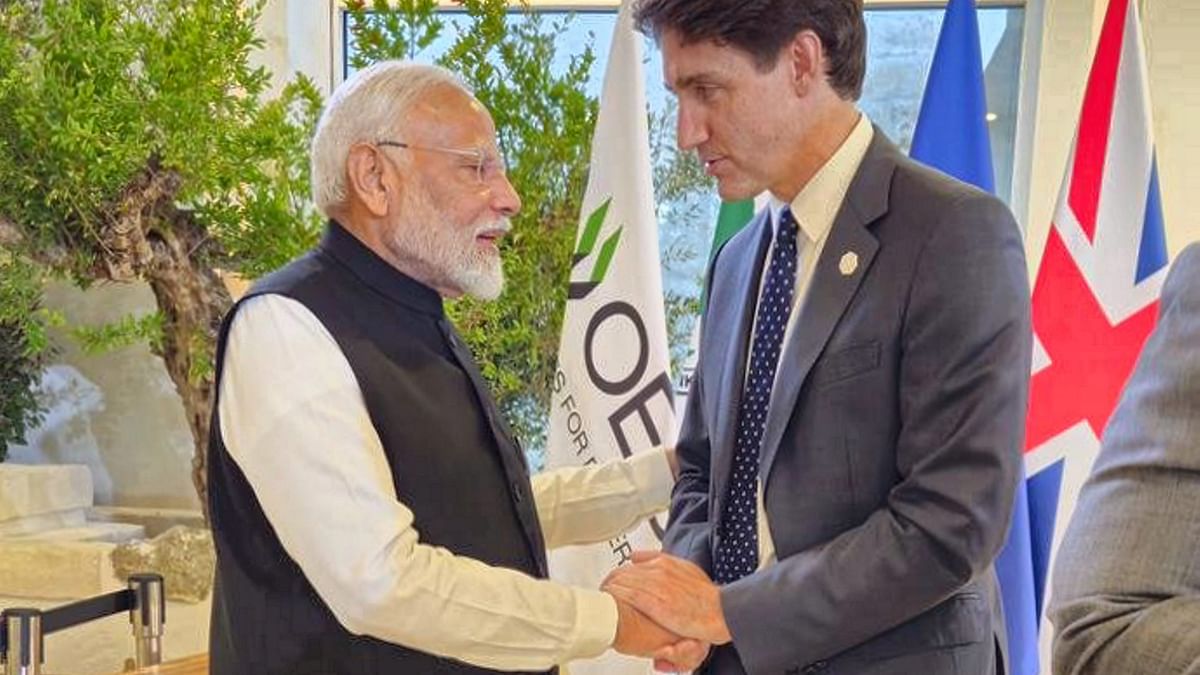 Prime Minister Narendra Modi and Prime Minister of Canada Justin Trudeau exchange greetings during the G7 summit, in Apulia, Italy.