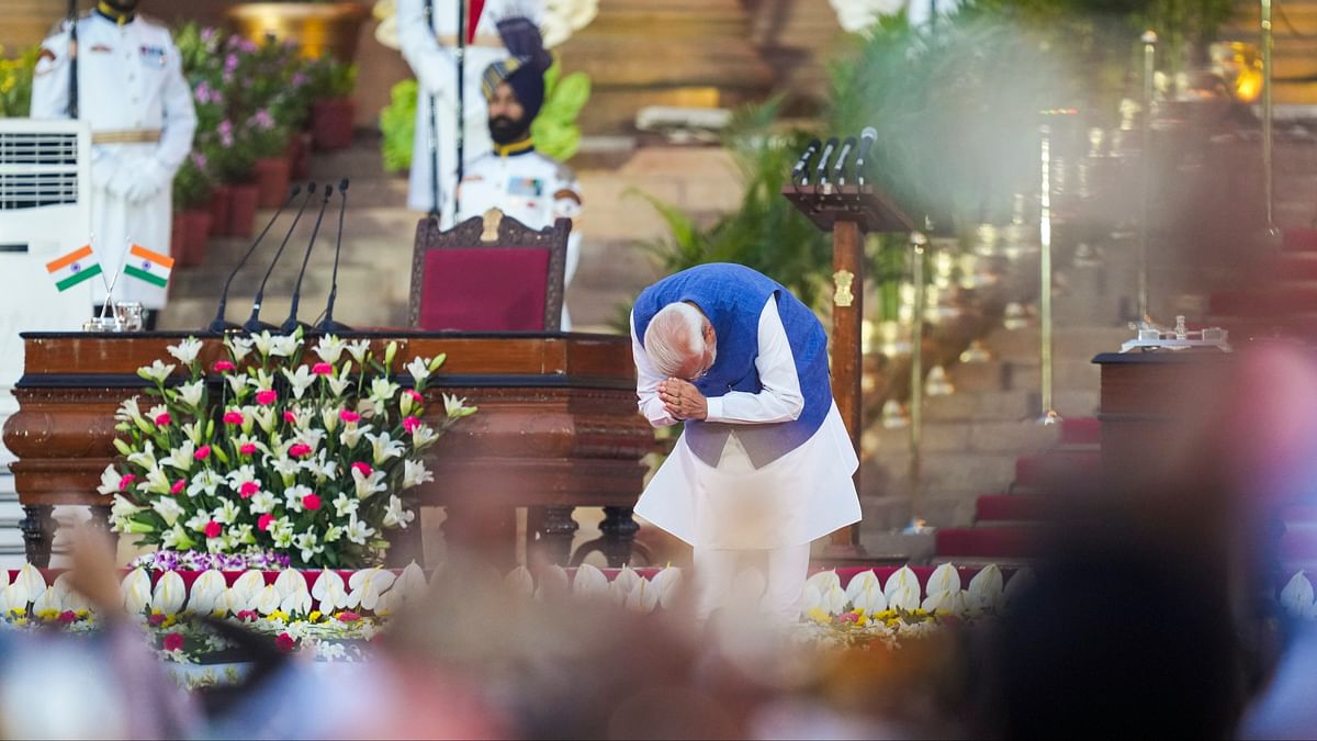 PM-designate Narendra Modi greets as he arrives as he arrives to take oath as prime minister for the third consecutive term, at Rashtrapati Bhavan in New Delhi.