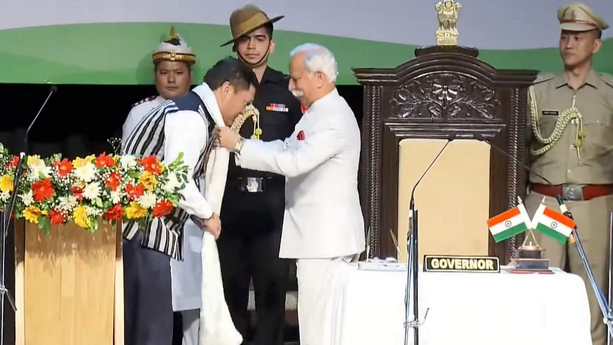 Arunachal Pradesh Governor Kaiwalya Trivikram Parnaik greets Pema Khandu after administering him oath of office at the DK State Convention Centre in Itanagar.