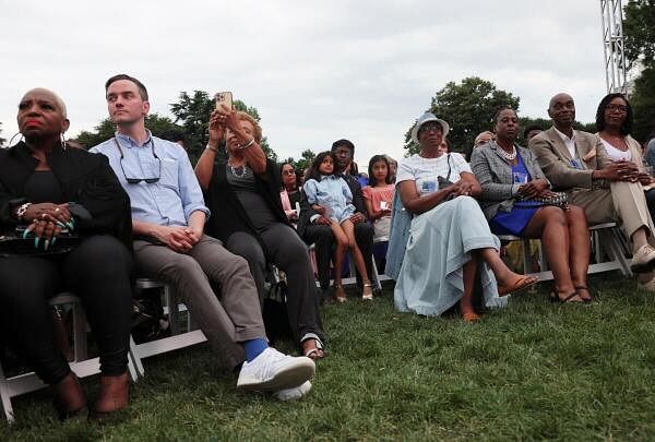 People attend a Juneteenth concert hosted by U.S. President Joe Biden on the South Lawn at the White House in Washington.