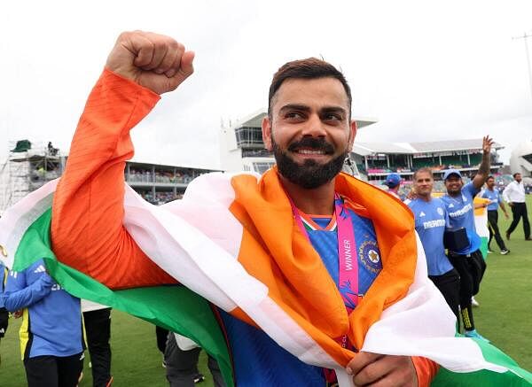 Virat Kohli  celebrates with an Indian flag wrapped around him after the star batter regained his form at the right time to strike a fifty as India made a healthy 176 for seven against South Africa. Kohli’s 76 (59b, 6x4, 2x6), was his first decisive knock of this tournament.