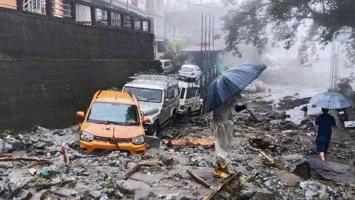 Vehicles stuck in mud and silt following landslides triggered by incessant rainfall, in North Sikkim.