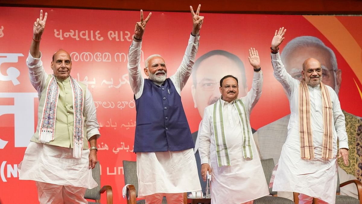 Union Defence Minister Rajnath Singh, Prime Minister Narendra Modi,  BJP National President JP Nadda and Union Home Minister Amit Shah flash victory signs during a meeting at the party headquarters as the party leads in the Lok Sabha elections amid the counting of votes, in New Delhi.