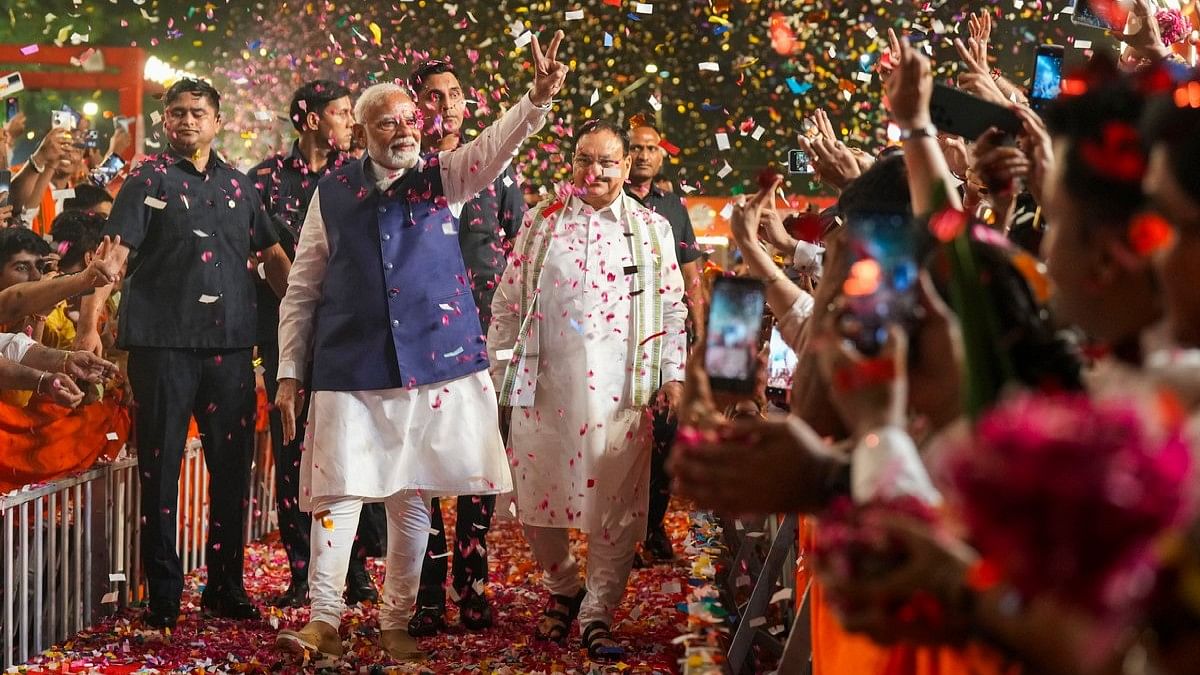 Prime Minister Narendra Modi gets a warm welcome by the supporters on his arrival at the party headquarters, in New Delhi.