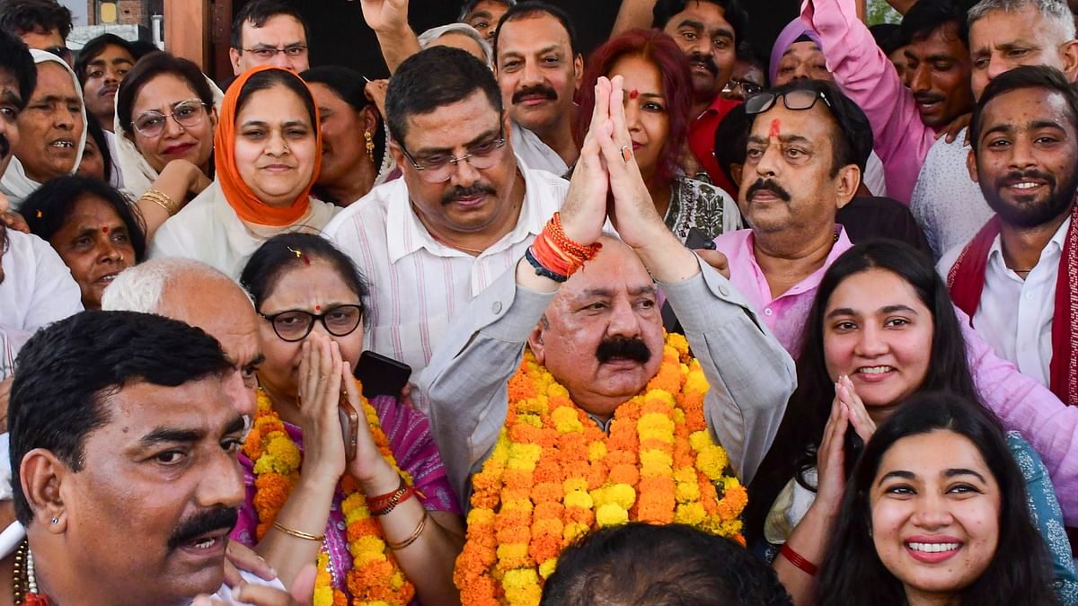 Congress candidate from Amethi constituency Kishori Lal Sharma celebrates his win with others  in the Lok Sabha elections.