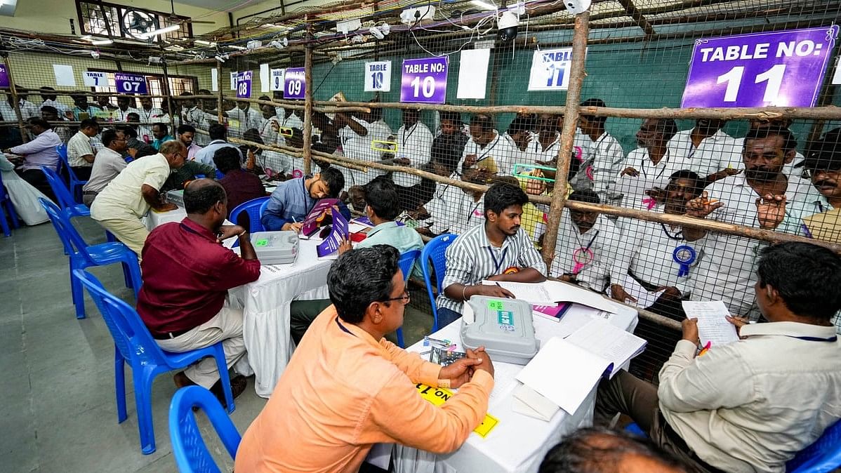 Polling officials at a counting centre during counting of votes for Lok Sabha elections, at a college in Chennai.