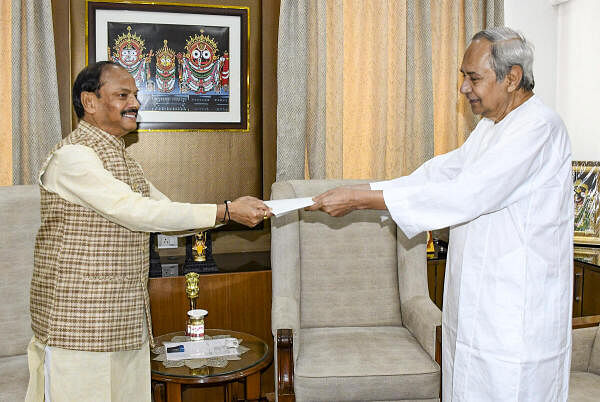 Outgoing Odisha Chief Minister Naveen Patnaik tenders his resignation letter to Governor Raghubar Das, after the defeat of his party in the state assembly elections, at Raj Bhavan, in Bhubaneswar, Wednesday, June 5, 2024. 