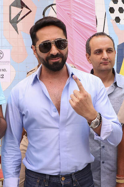 Bollywood actor Ayushmann Khurrana poses for photographs after casting his vote in Chandigarh.