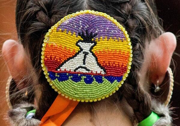 A beaded piece of regalia is seen on the back of a dancer’s head during the 43rd annual Kamloopa Powwow, in Kamloops, British Columbia, Canada.