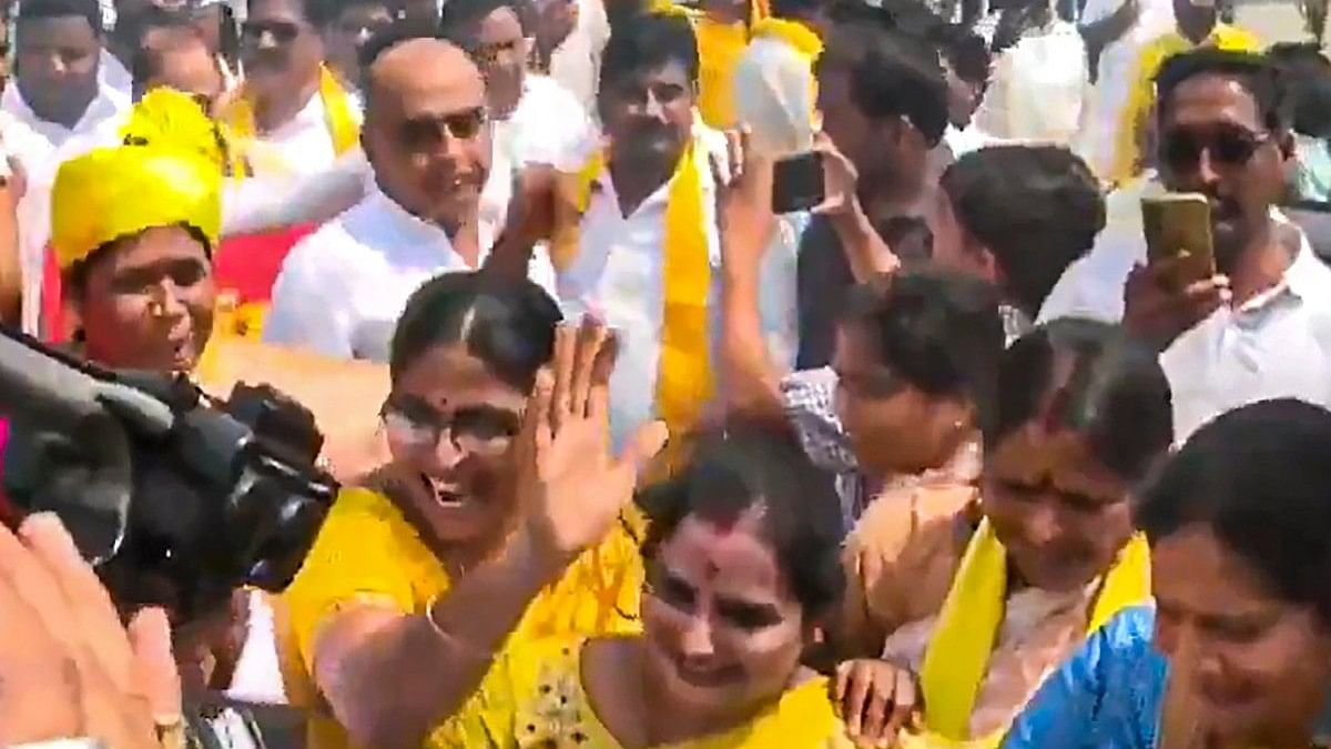 Women workers dance as they celebrate TDP's performance in the Assembly polls, at the party central office, in Guntur.