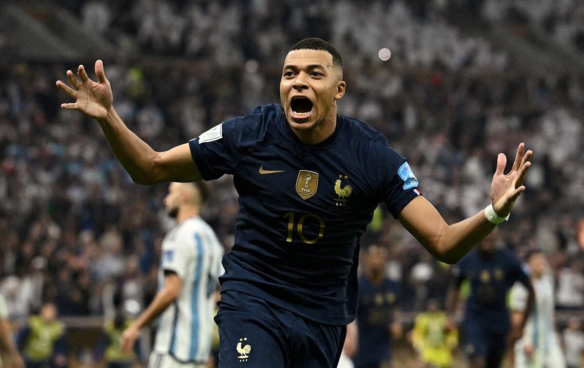 France's Kylian Mbappe celebrates scoring their third goal to complete his hat-trick in the World Cup final. 