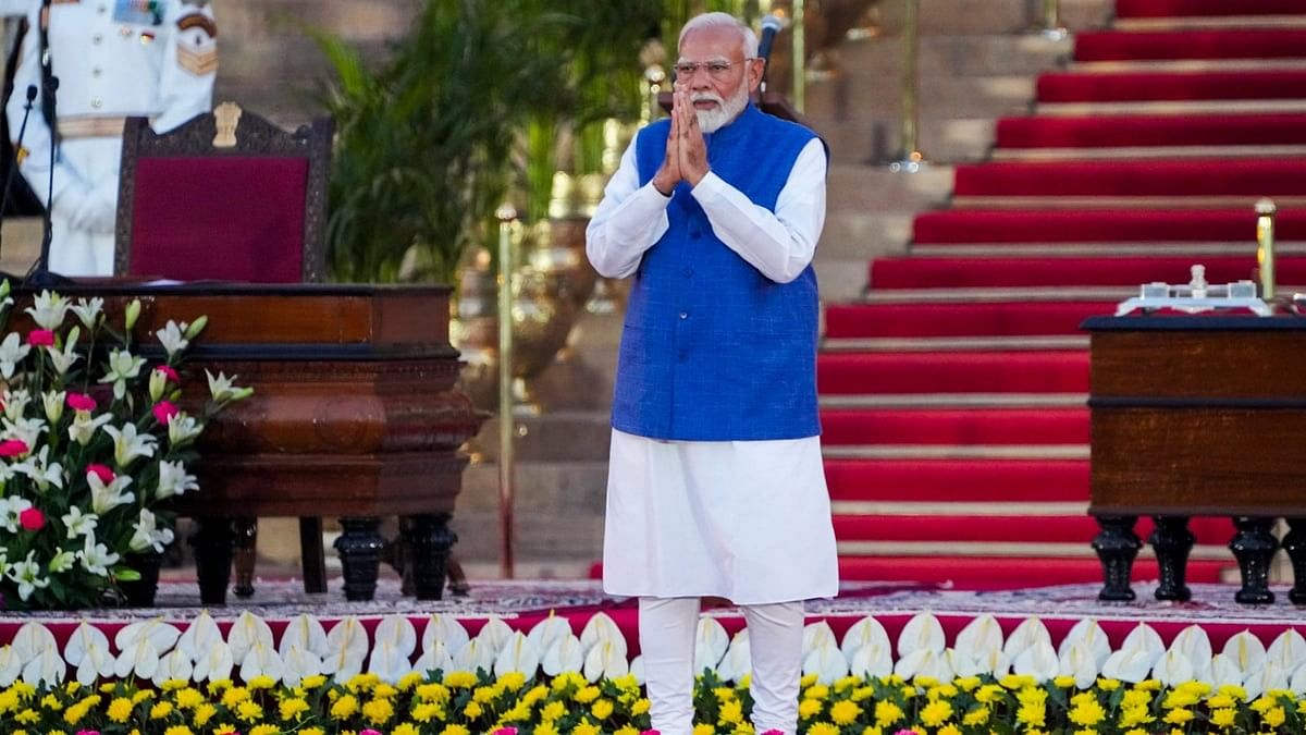 Narendra Modi greets as he arrives to take oath as prime minister for the third consecutive term, at Rashtrapati Bhavan in New Delhi.