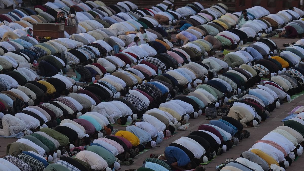 Muslim devotees offer 'namaz' on Eid ul-Adha festival at Jama Masjid in New Delhi.