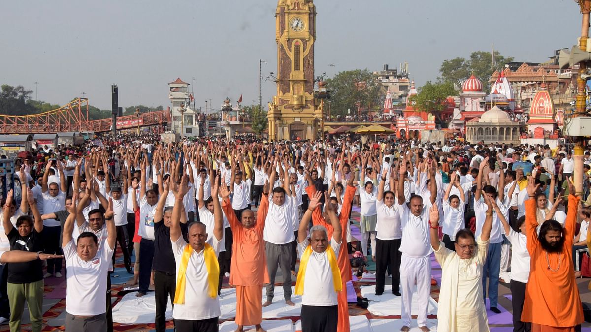People perform yoga on the 10th International Day of Yoga, at Har Ki Pauri in Haridwar.