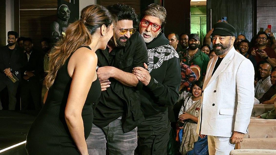 A candid picture of Deepika Padukone, Prabhas, Amitabh Bachchan and Kamal Haasan sharing sweet nothings.  