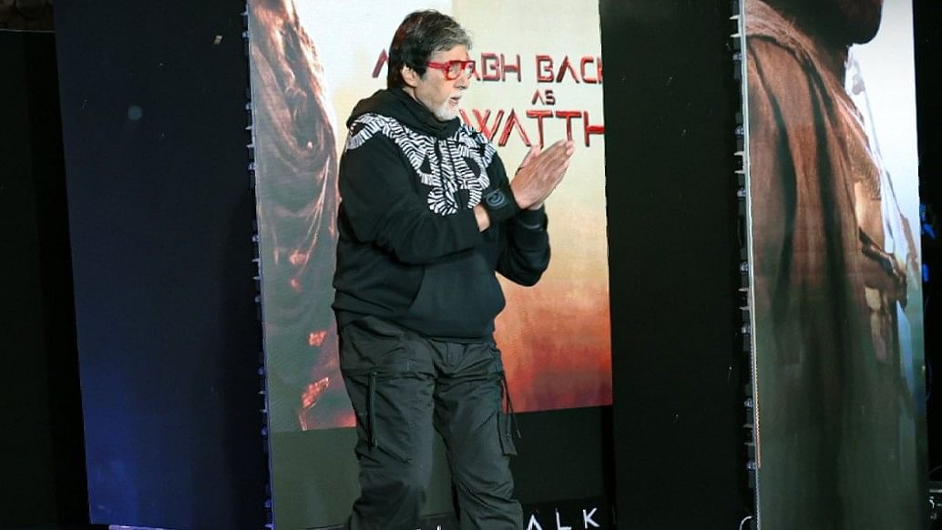 Amitabh Bachchan, who plays the immortal Ashwatthama, gestures as he arrives on the stage.