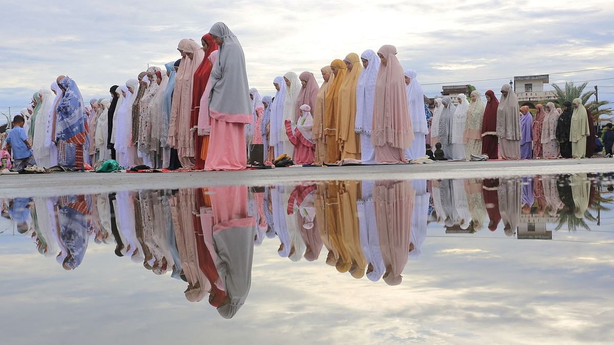 Muslims offer mass prayers at Baitul Makmur Grand Masque during Eid ul-Adha celebrations in Meulaboh, Indonesia.