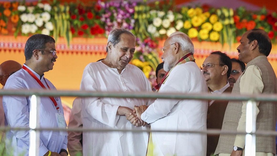 Prime Minister Narendra Modi being greeted by former Odisha chief minister Naveen Patnaik during the swearing-in ceremony of new Odisha government, in Bhubaneswar, Wednesday, June 12, 2024. Union Minister J P Nadda and Governor Raghubar Das are also seen.