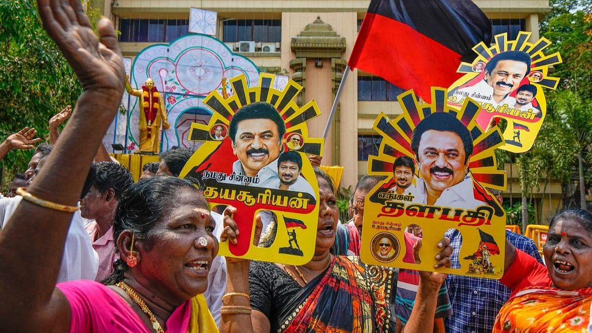 DMK supporters celebrate the party's lead during the counting of votes for Lok Sabha elections, at party headquarters, Anna Arivalayam, in Chennai.