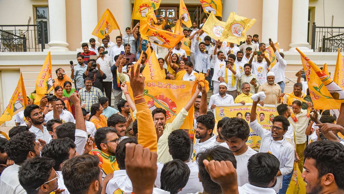 TDP supporters celebrate the party's lead in the Andhra Pradesh Assembly polls and Lok Sabha polls, in Hyderabad.