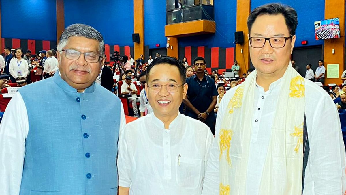 Union Minister Kiren Rijiju with BJP leader Ravi Shankar Prasad and Sikkim CM Prem Singh Tamang at the swearing-in ceremony of Arunachal Pradesh Chief Minister Pema Khandu in Itanagar.