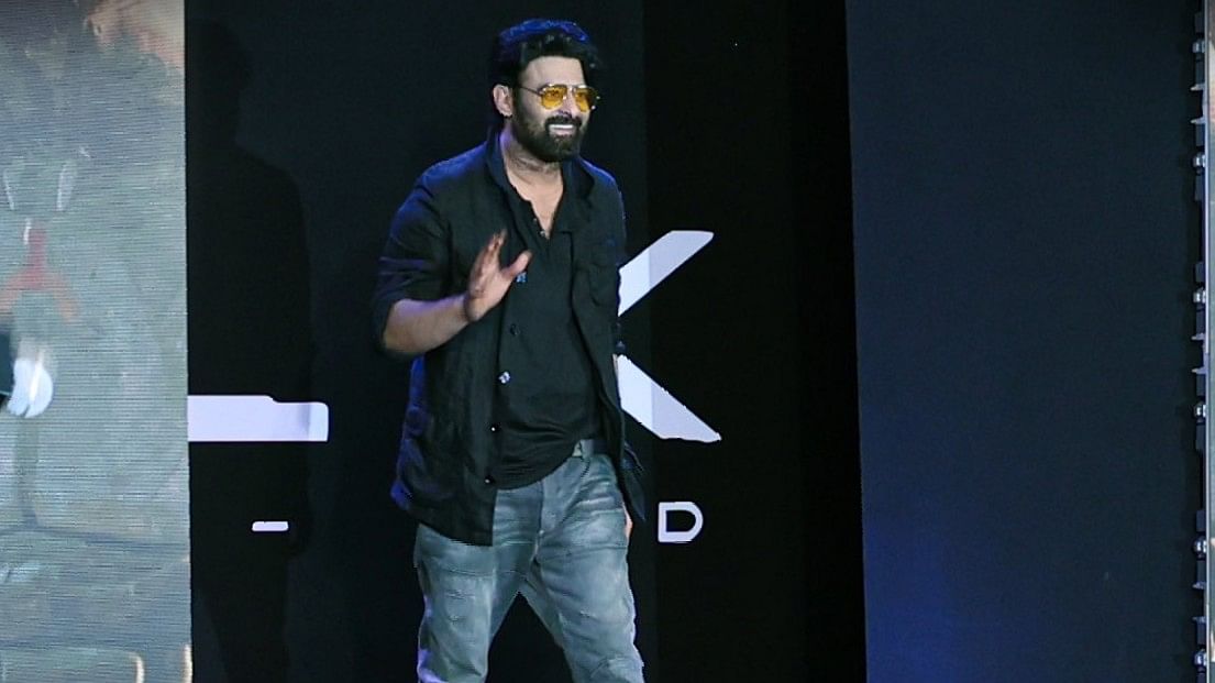 Prabhas is all smiles as he arrives on the stage.