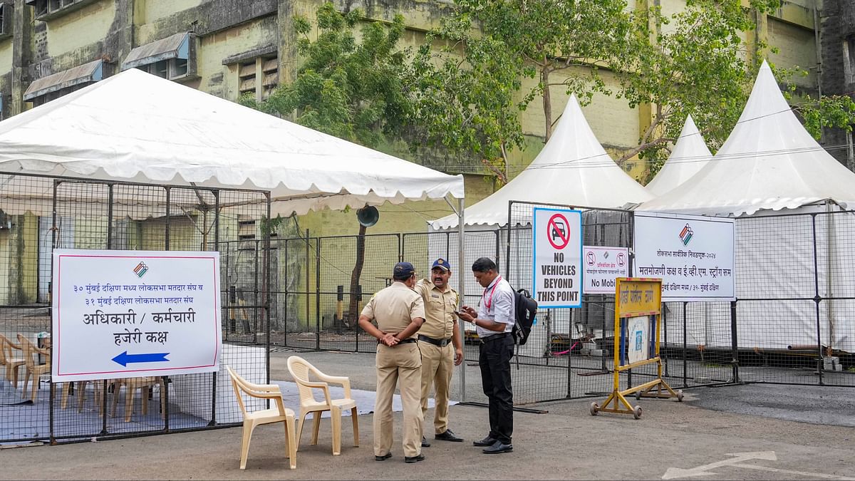 Security personnel stand guard outside a counting centre, a day before counting of votes for the Lok Sabha elections, in Mumbai.