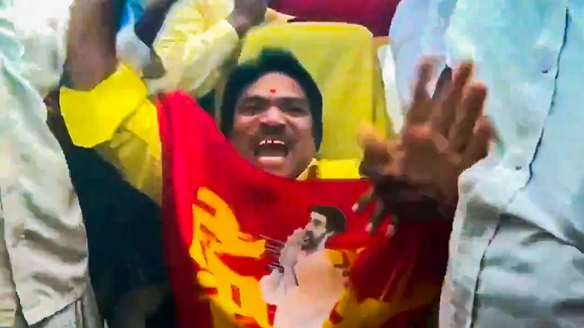 TDP supporters celebrate their lead in the Assembly polls, at the party central office, in Guntur.