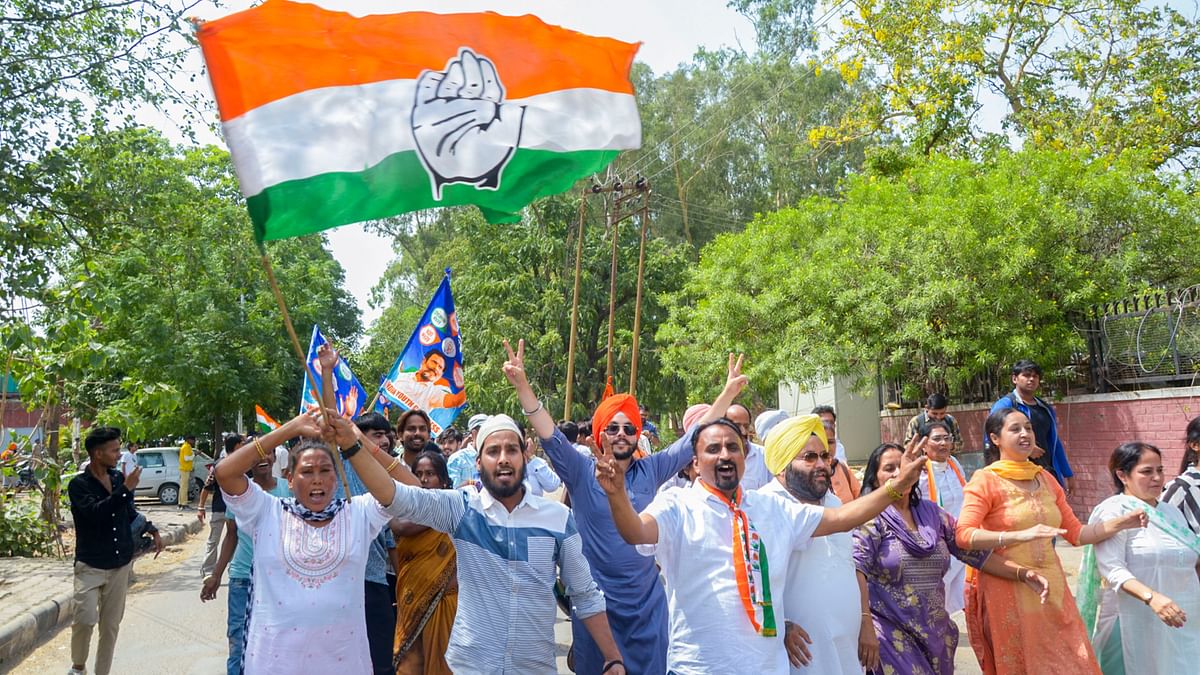 Congress party supporters celebrate the party's gain in the Lok Sabha elections on the day of counting of votes, in Chandigarh.