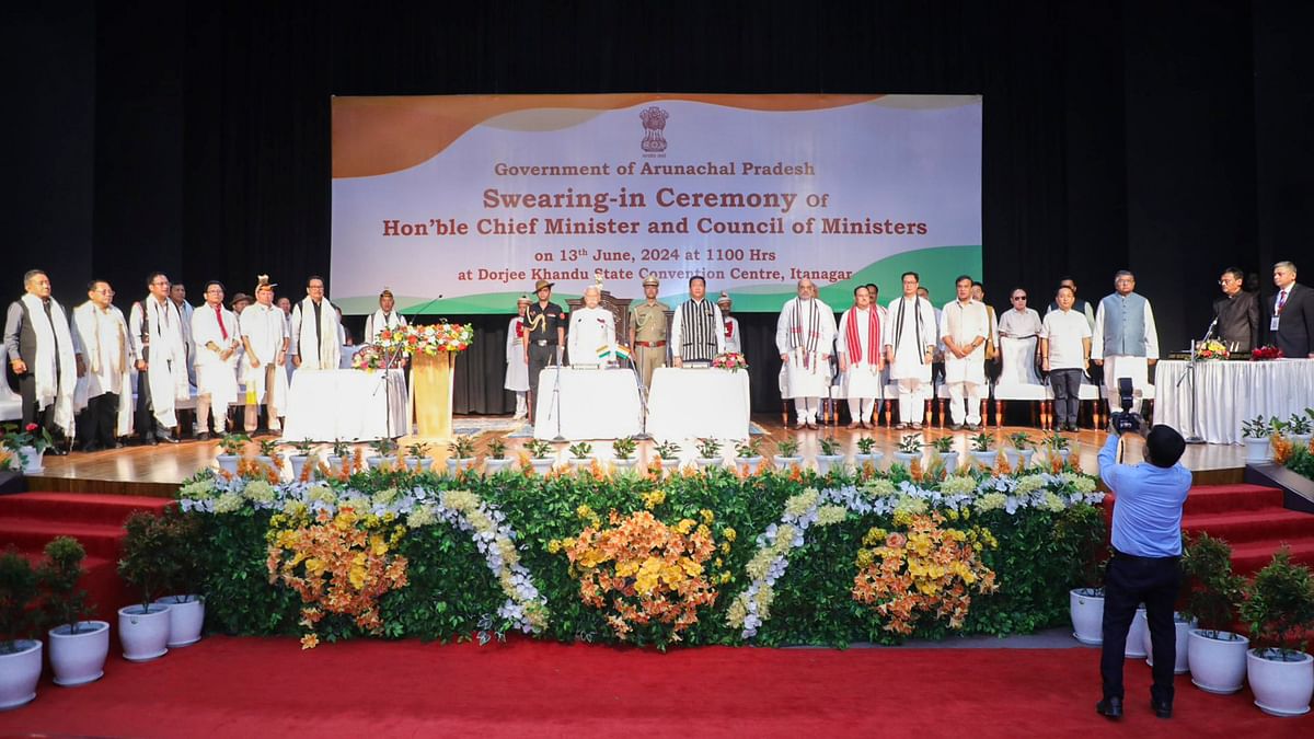 Arunachal Pradesh Governor Kaiwalya Trivikram Parnaik with state CM-designate Pema Khandu during the swearing-in ceremony at the DK State Convention Centre in Itanagar.