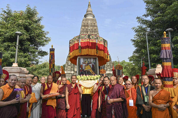 Buddhist monks during celebrations of the 89th birthday of Tibetan spiritual leader the Dalai Lama at Mahabodhi temple in Bodh Gaya.