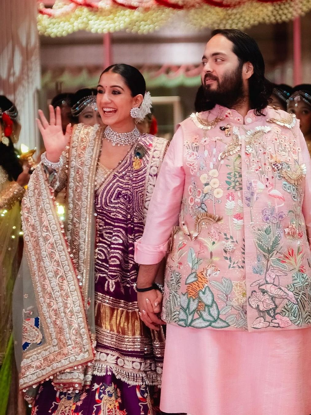 Radhika looked absolutely gorgeous in a purple lehenga choli and dazzled in diamonds on the garba night while Anant donned a pink kurta set and an embellished jacket.