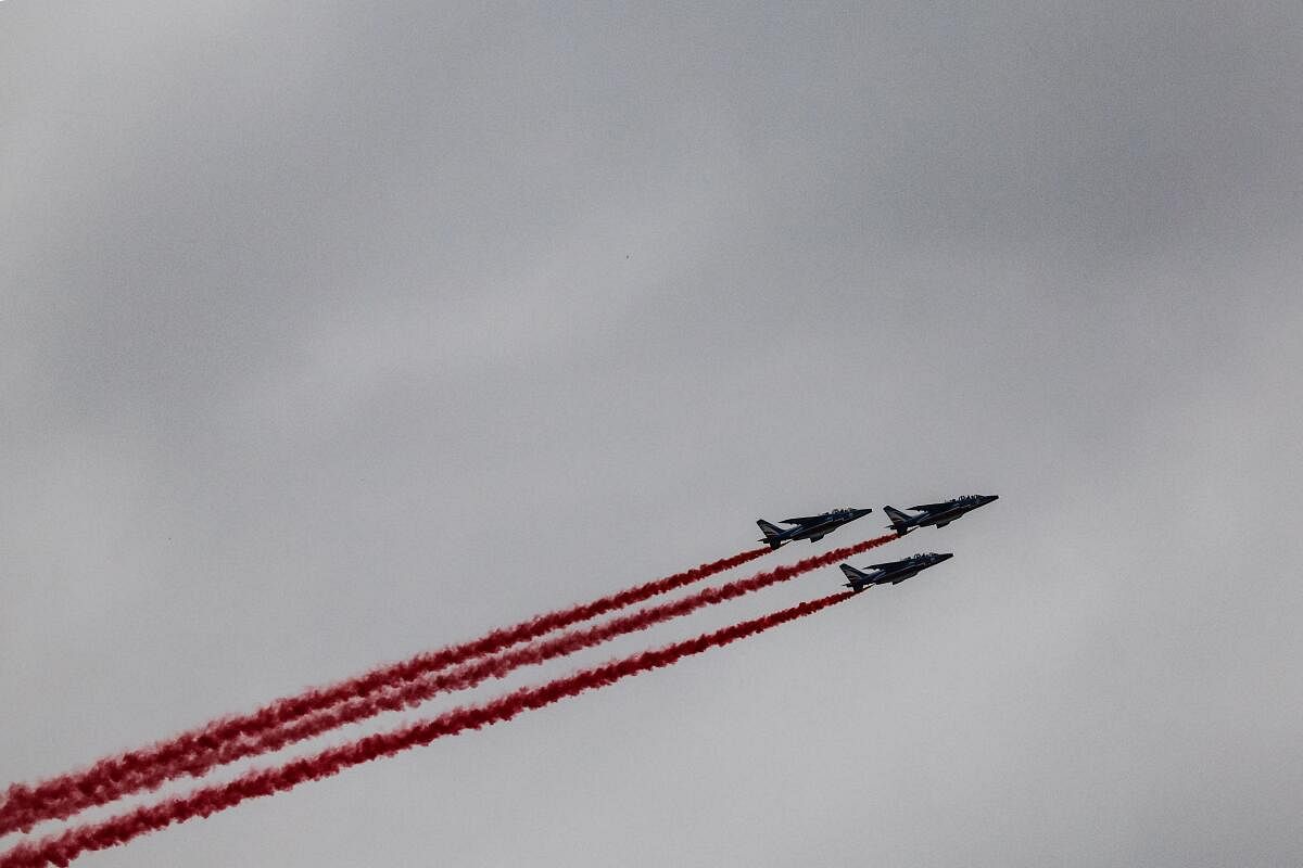 The French Air Force elite acrobatic flying team "Patrouille de France" (PAF) performs during the opening ceremony.