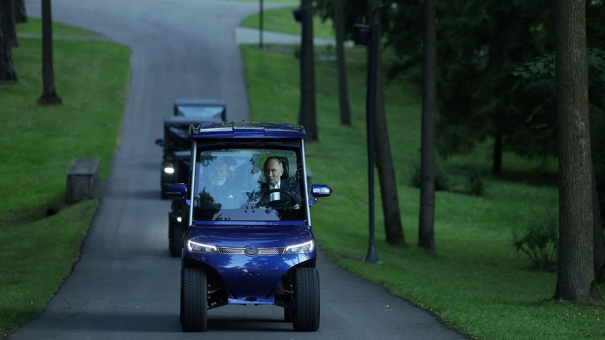 Vladimir Putin and Narendra Modi enjoy a golf cart ride during their meeting at the Novo-Ogaryovo state residence near Moscow, Russia.