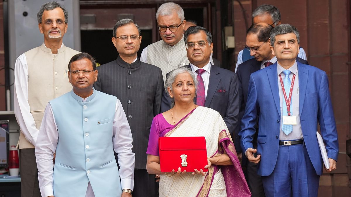 Finance Minister Nirmala Sitharaman  posed for the traditional  picture  along with her team outside the Finance Ministry in North Block before leaving for Parliament.