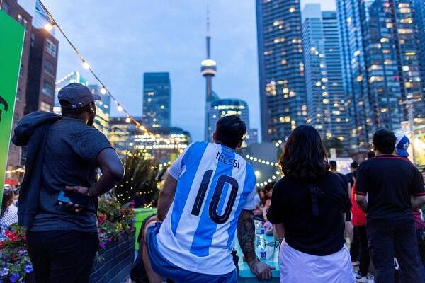 Football fans watch the televised Copa America semi-final match between Canada and Argentina, in Toronto, Ontario, Canada.