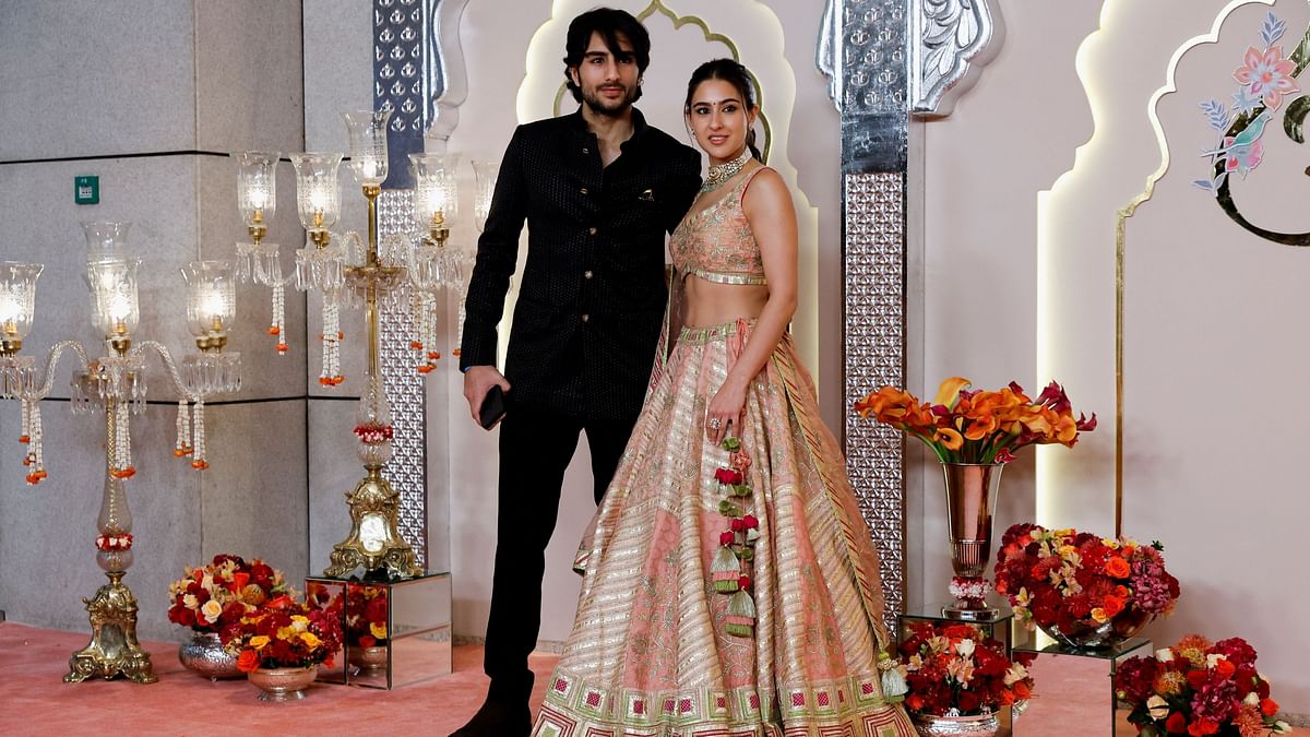 Actress Sara Ali Khan poses with her brother Ibrahim Ali Khan pose for pictures as they arrive for Anant Ambani and Radhika Merchant's wedding.