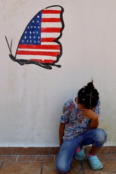 Migrants rest before continuing their journey toward the US, in Tapachula.