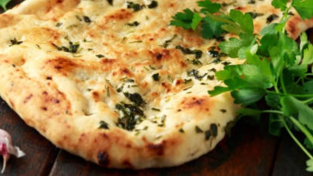 Rank 07| Butter Garlic Naan (India) - Garlic Naan bread is Indian flatbread made with all-purpose flour and spiced with garlic.