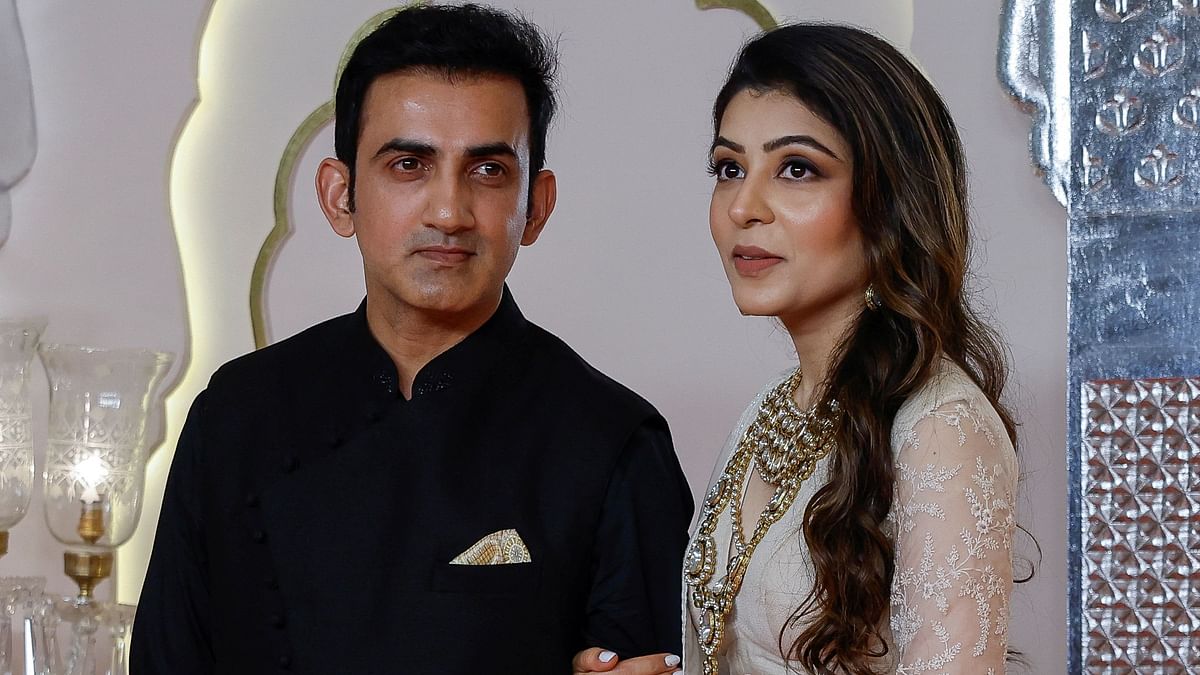 Newly appointed Indian cricket team coach Gautam Gambhir and his wife Natasha Jain pose for pictures on the red carpet.