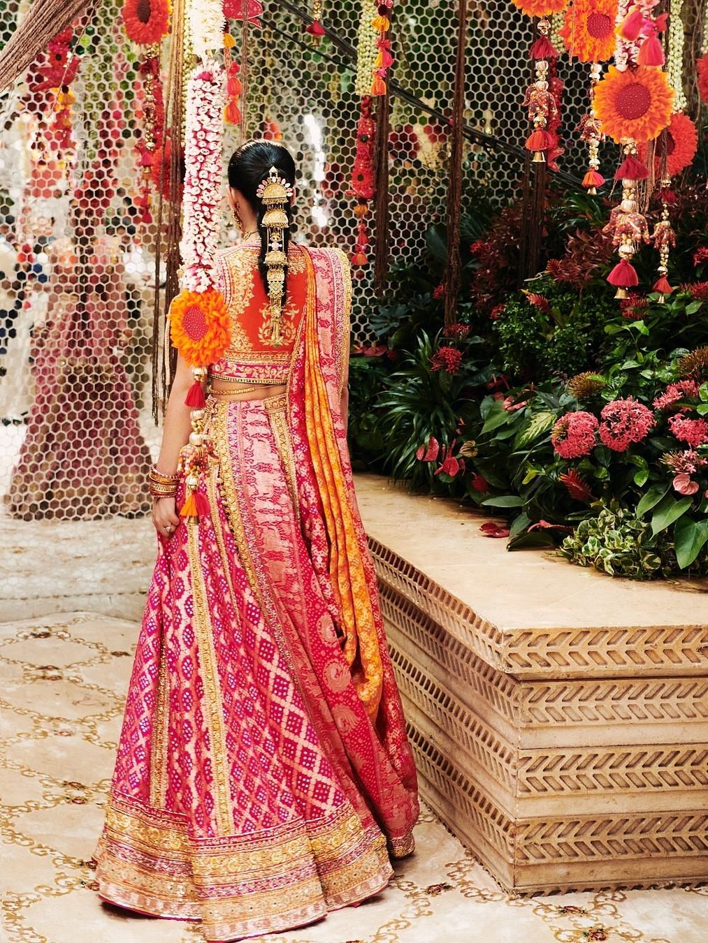 The lehenga was embroidered with Durga Maa shlokas and 35 meters of bandhej fabric were used to create the ghagra.