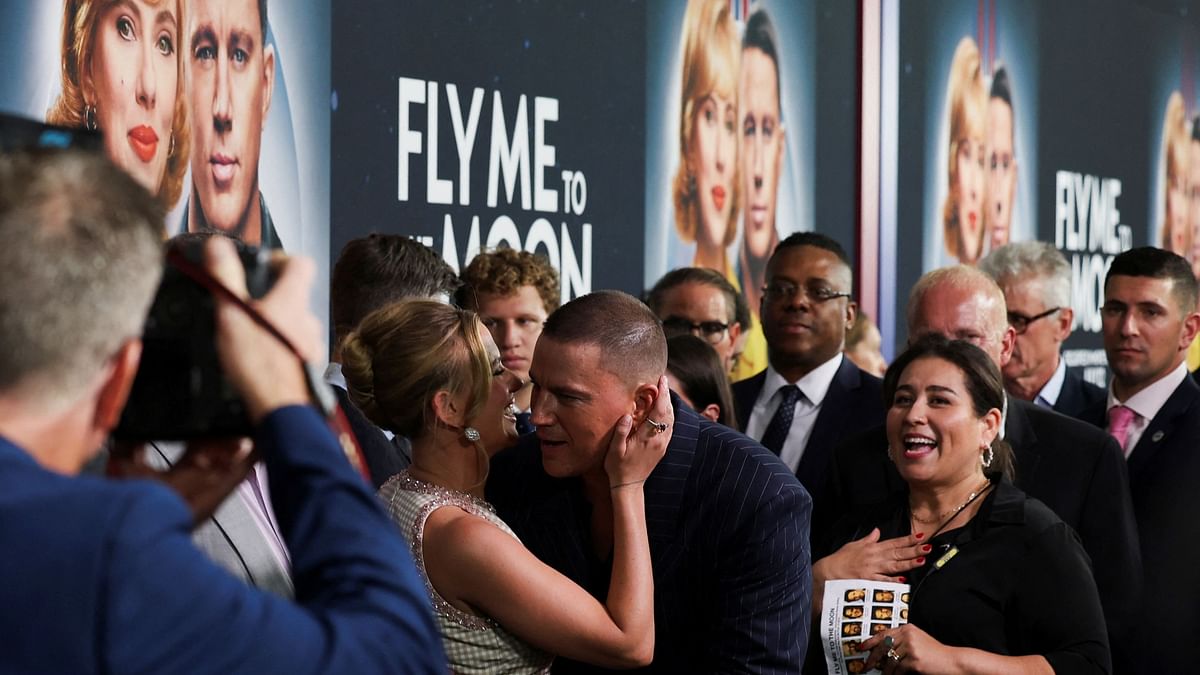 Scarlett Johansson and Channing Tatum exchange greetings during the special screening of Fly Me to the Moon in New York.