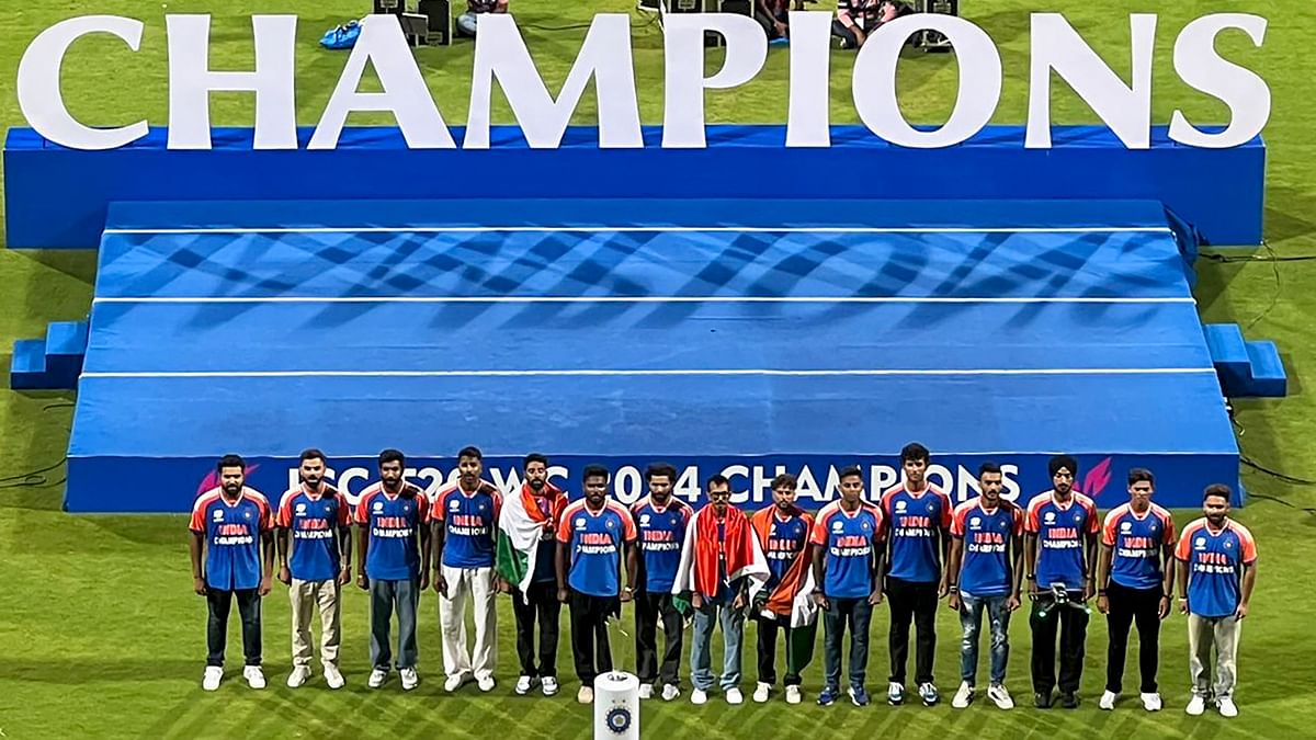 The T20 World Cup-winning Indian cricket team with the championship trophy during their felicitation ceremony at the Wankhede Stadium, in Mumbai.