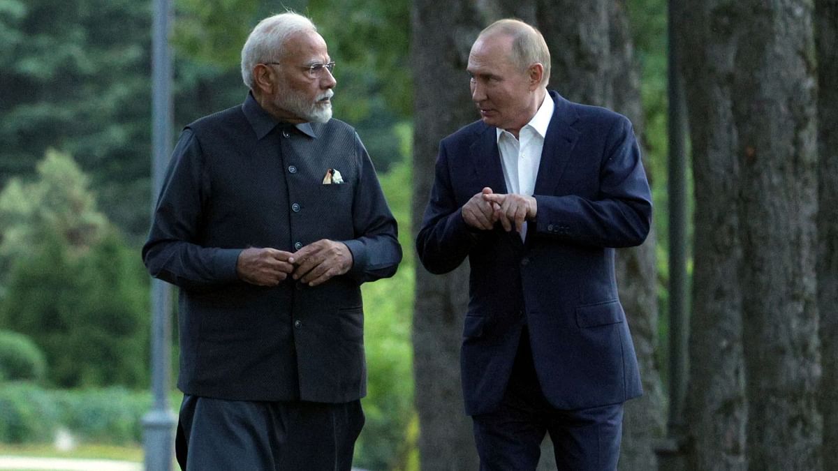 Narendra Modi and Vladimir Putin are seen enjoying a stroll during their meeting at the Novo-Ogaryovo state residence near Moscow, Russia.