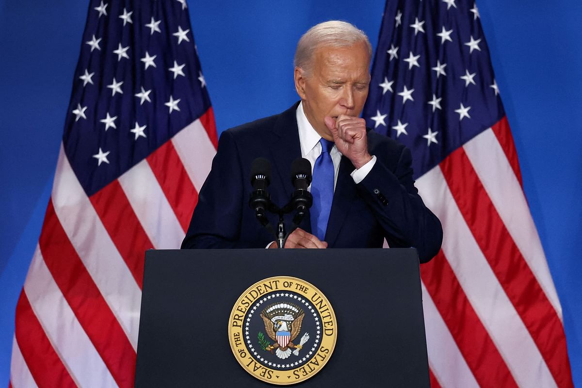 US President Joe Biden coughs at a press conference during NATO's 75th anniversary summit, in Washington, US, July 11, 2024.