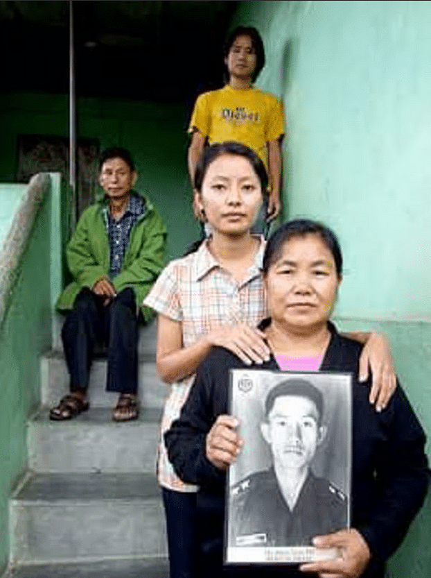 The family of Capt Neikezhakuo Kenguruse with his photo