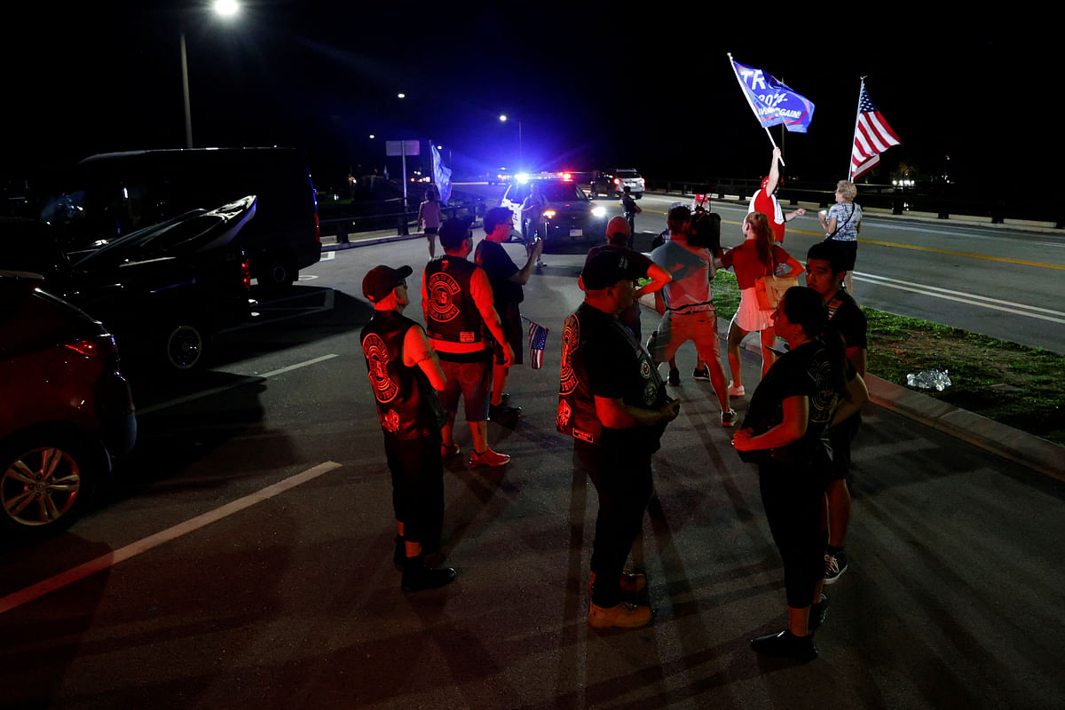 People gather after Republican presidential candidate and former U.S. President Donald Trump was injured when shots were fired, in Palm Beach.